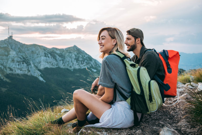 happy young woman man hikingmountains