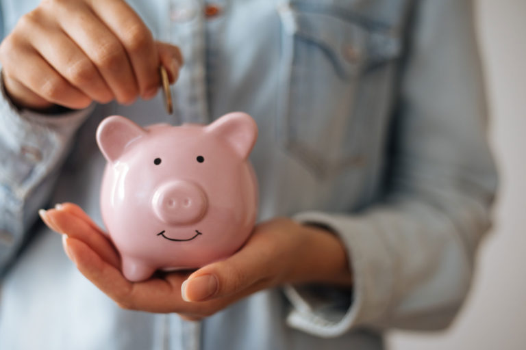 piggy bank putting money in
