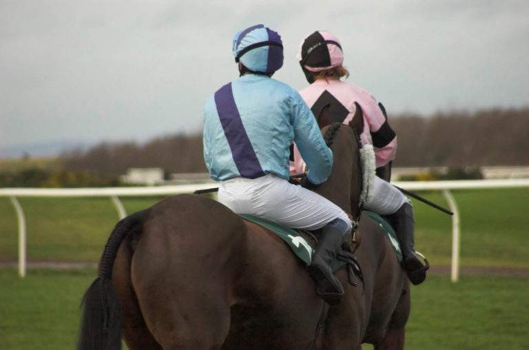 racehorses jockeys backs