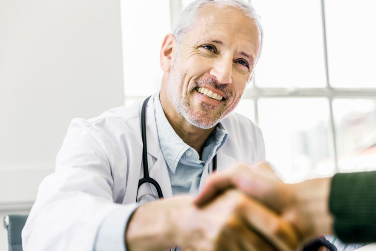 vet man shaking hands business happy