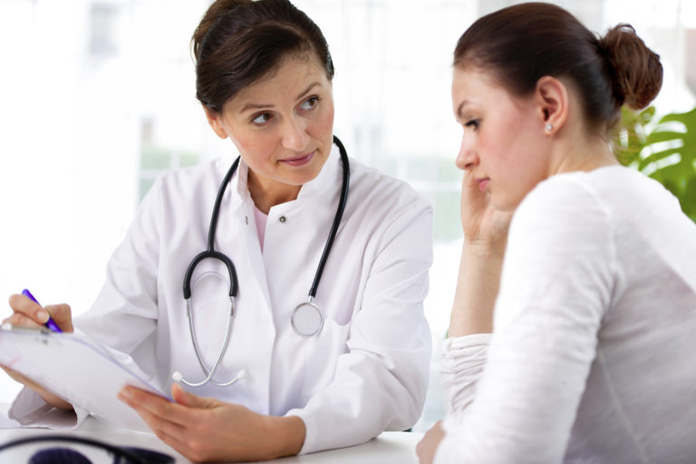 vet-talking-to-young-woman staff-2400