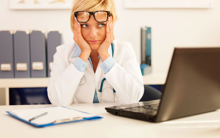 vet woman unhappy computer