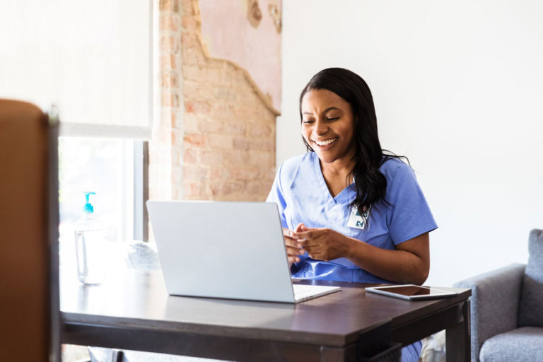 vet woman of color happy computer