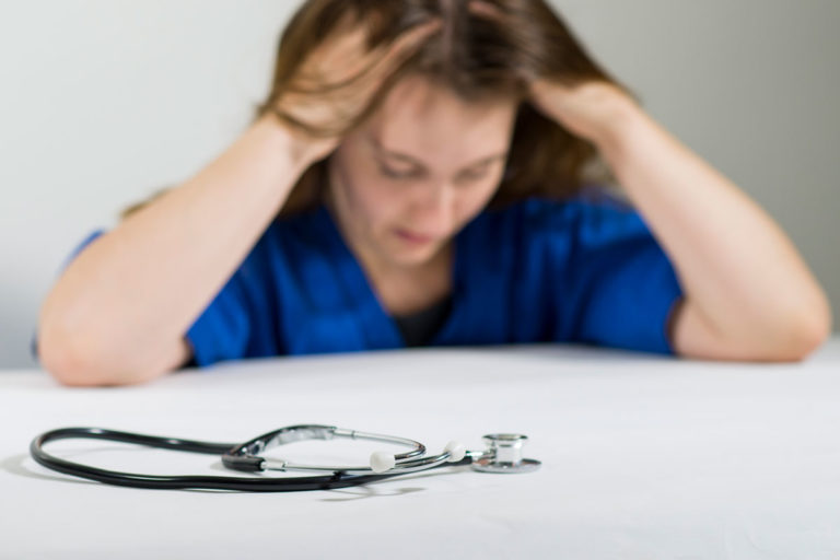 vet woman scrubs stress burnout