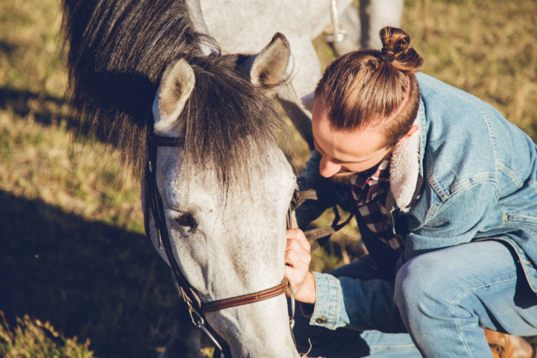 woman horse head kneeling unhappy