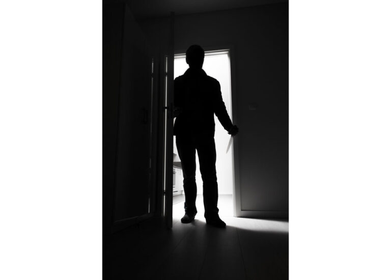 man entering dark room