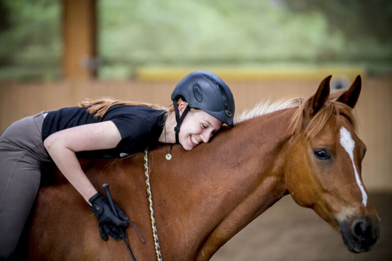 woman bareback bridleless happy horse