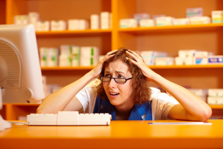 pharmacy woman upset at computer