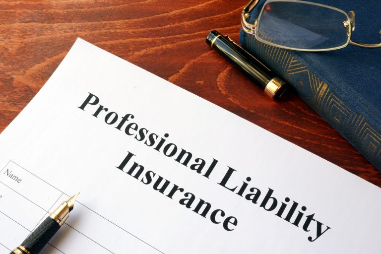 Professional liability insurance policy on a table
