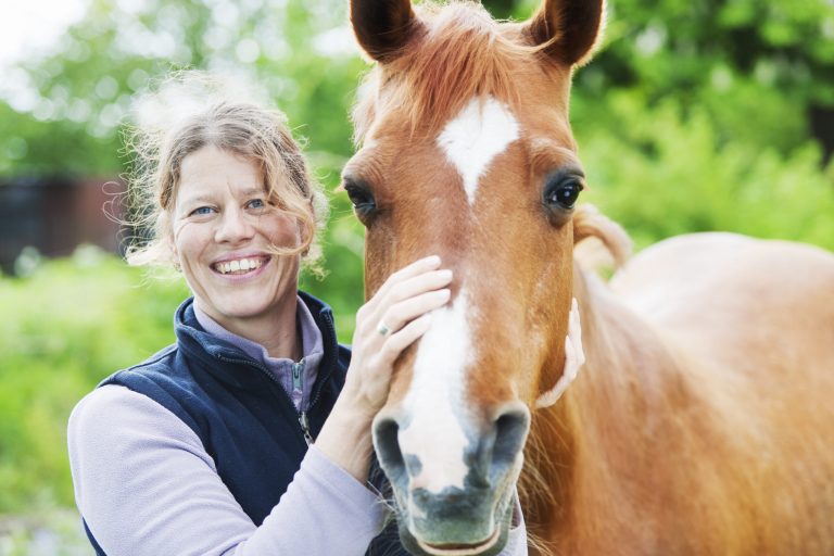 Female veterinarian with her horse