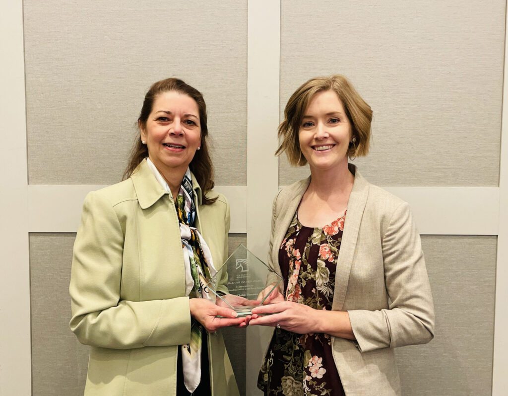 American Horse Council president Julie Broadway, left, presents Chelsie Huseman, Ph.D., Texas A&M AgriLife Extension Service horse specialist in the Department of Animal Science, with the Van Ness Award for her efforts to promote and improve the equine industry. 