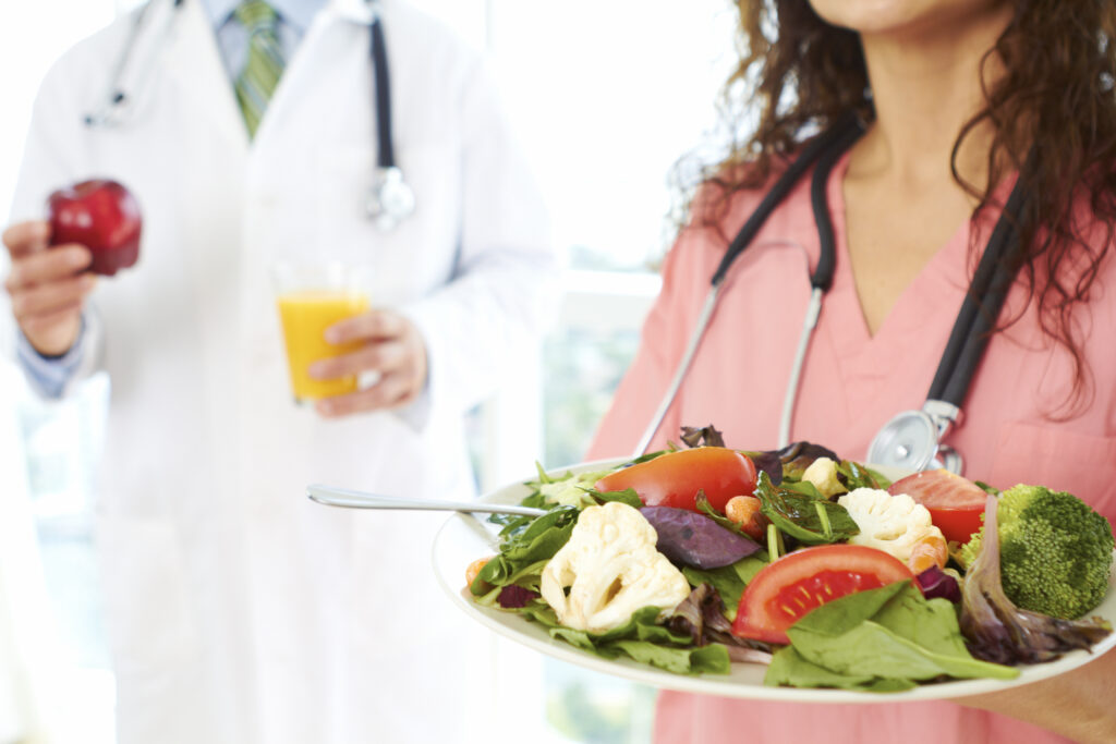 Doctors holding healthy food. 