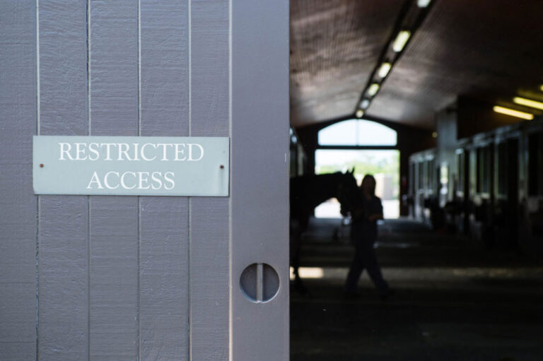 restricted access sign on barn door quarantine