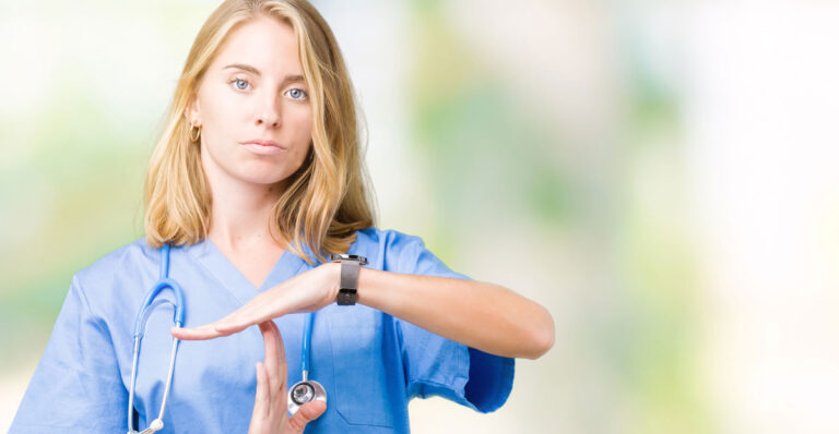 veterinarian giving time-out hand gesture