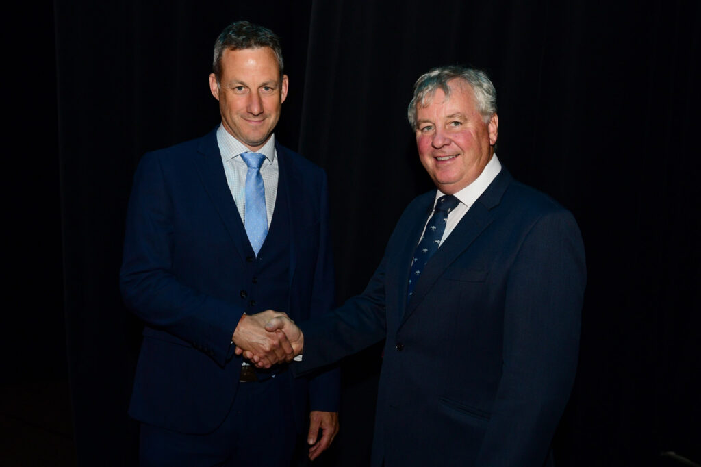 Roger Smith shaking hands while being inducted as BEVA president.