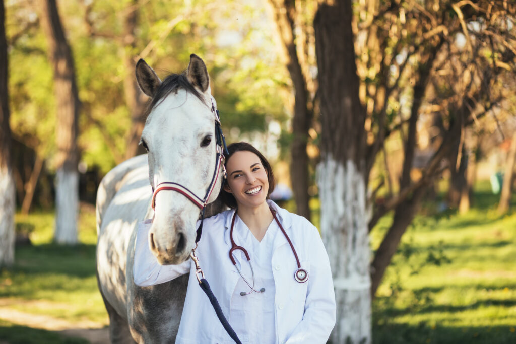 Veterinarian smiling because of the family-friendly culture in her practice. 