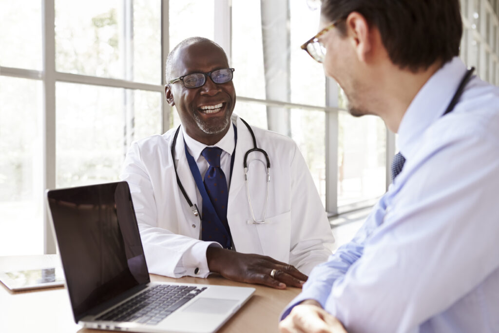 Two veterinarians meeting to talk about compensation. 