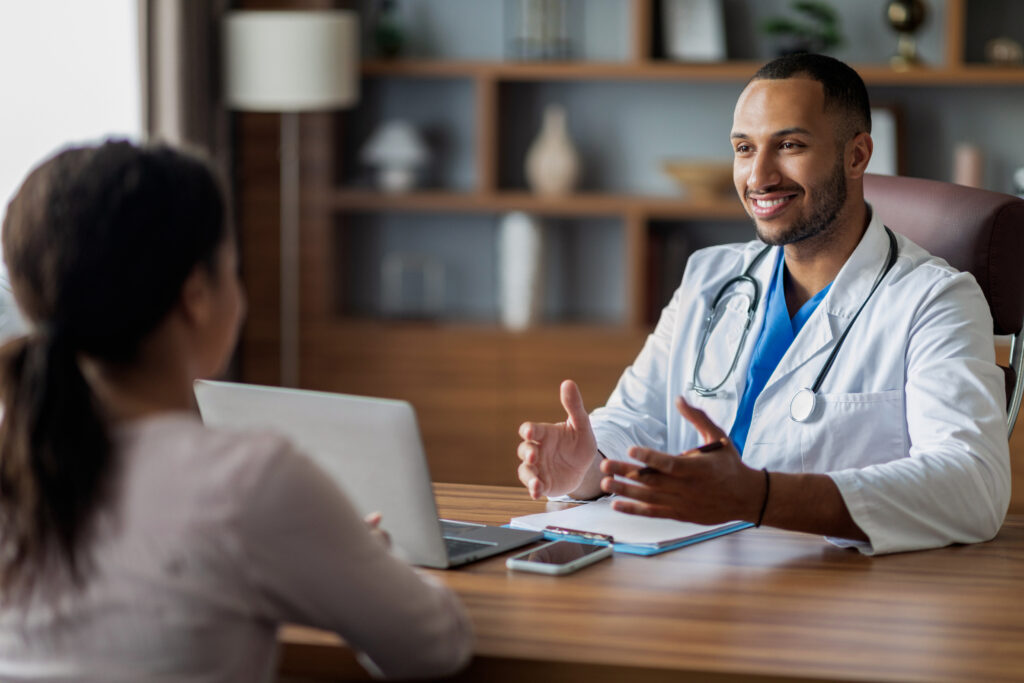 Veterinarian conducting stay interview with employee.