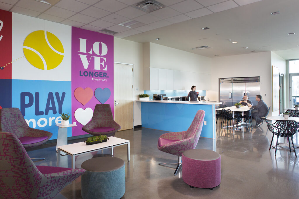 The break space in this veterinary hospital was designed to provide the staff with multiple seating options.