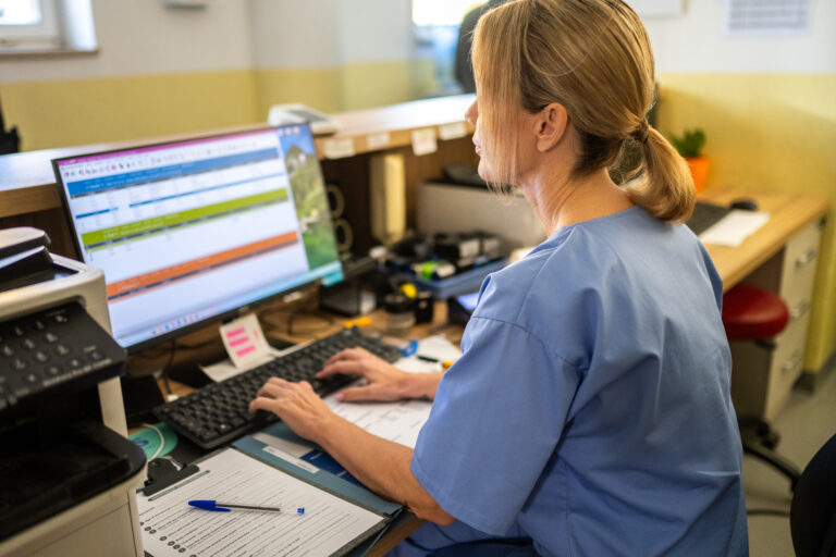 Caucasian Female Receptionist Working at Veterinary Clinic