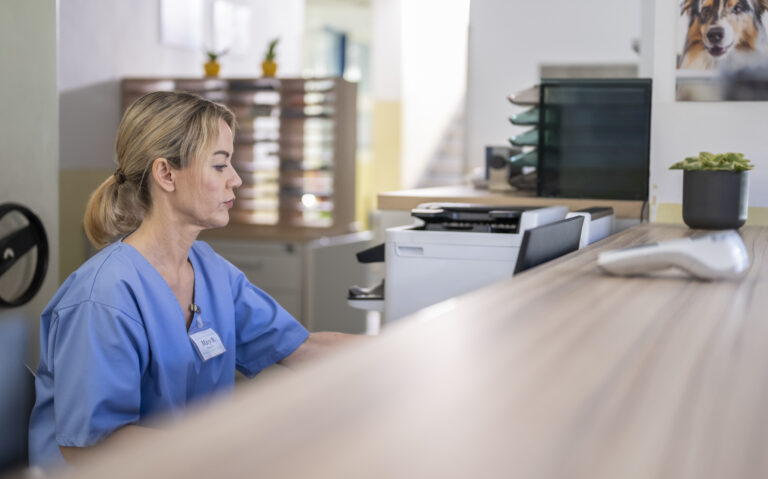 Caucasian Female Receptionist at Veterinary Clinic