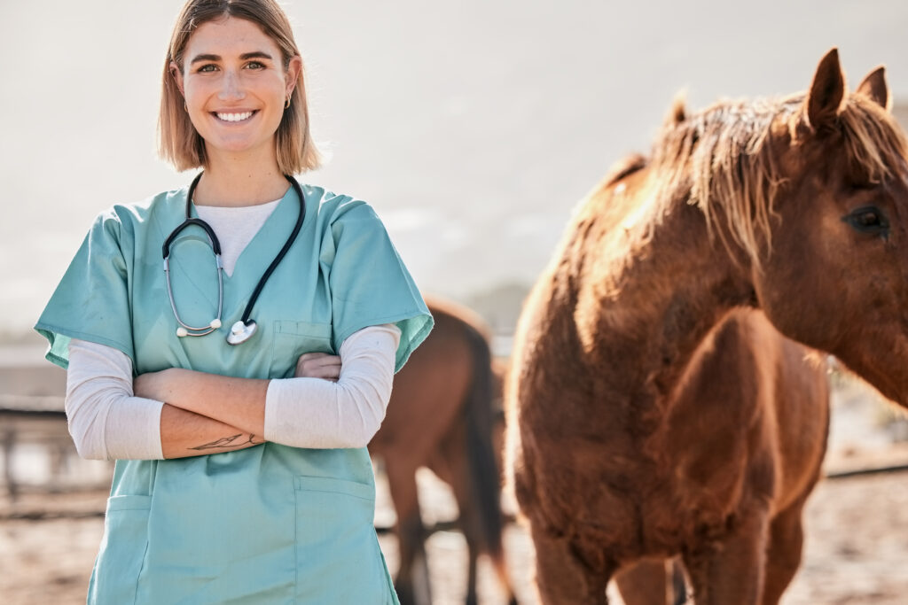 Happy equine veterinarian, illustrating quality of life (QOL) in veterinary practice