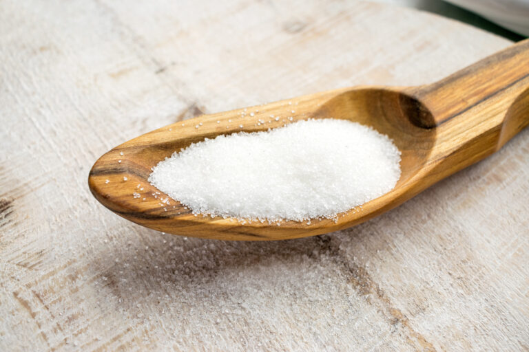 Artificial Sweeteners and Sugar Substitutes in wooden spoon