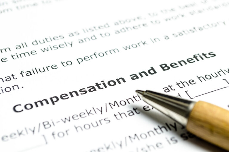 Compensation and benefits contract  with wooden pen