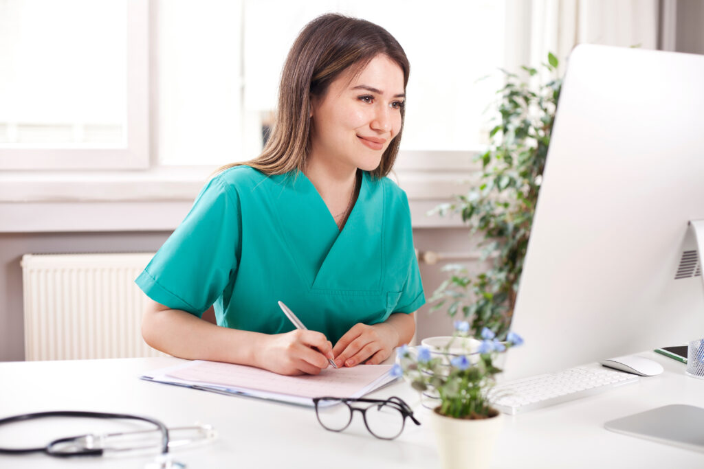 Veterinarian working at her computer.